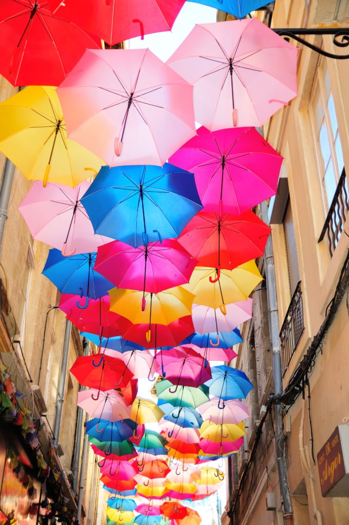 umbrella hanging beside buildings